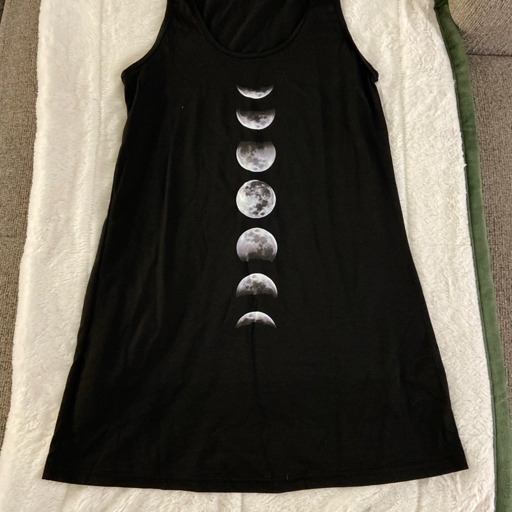 Never worn! This can be used as a cover up or a casual dress!
